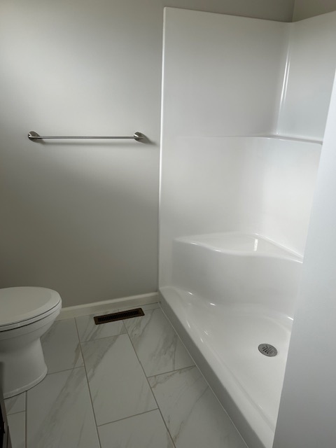79.2 Periwinkle Court Morris, IL 60450 - Photo 7 of 12 a bathroom with a granite countertop a toilet