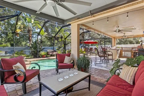 a outdoor living space with furniture and a rug