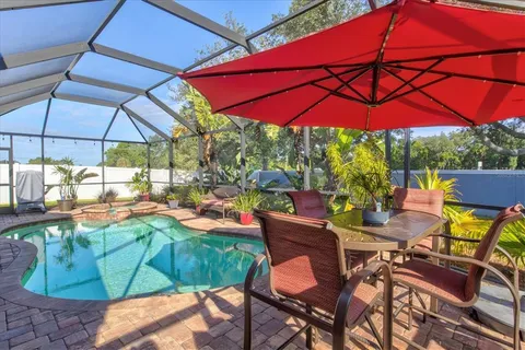 a view of a chair and table in the patio