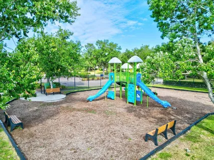 a view of a chairs setting in the backyard of a house