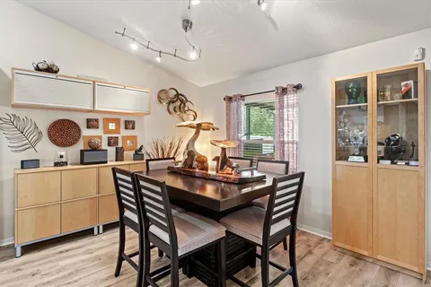 a view of a dining room with furniture window and wooden floor