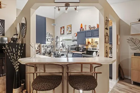 a dining room with furniture and window