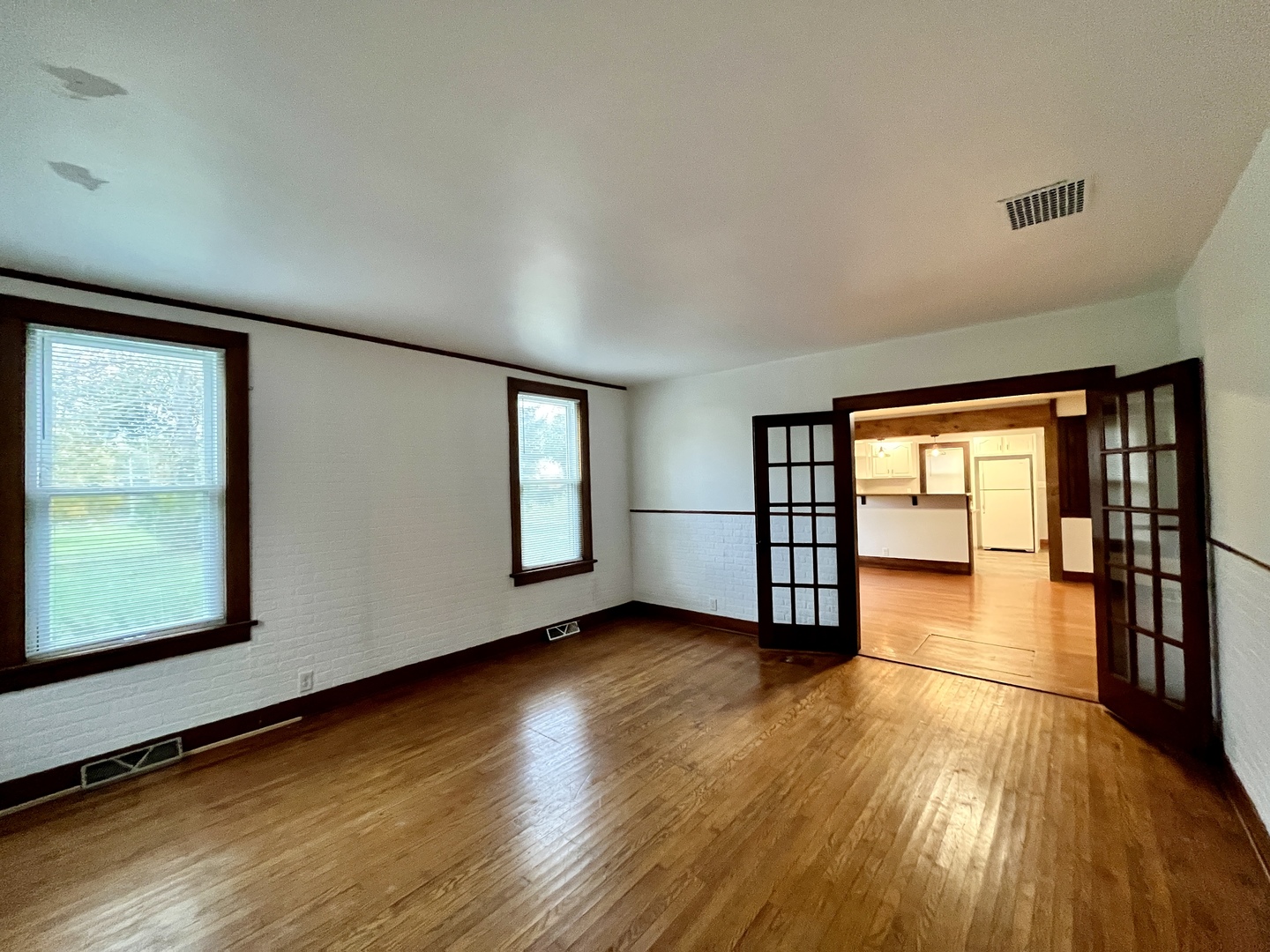 41W654 Main Street Road Elburn, IL 60119 - Photo 12 of 18 an empty room with wooden floor and windows