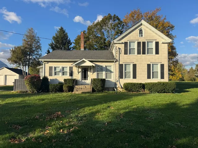 a front view of a house with a yard