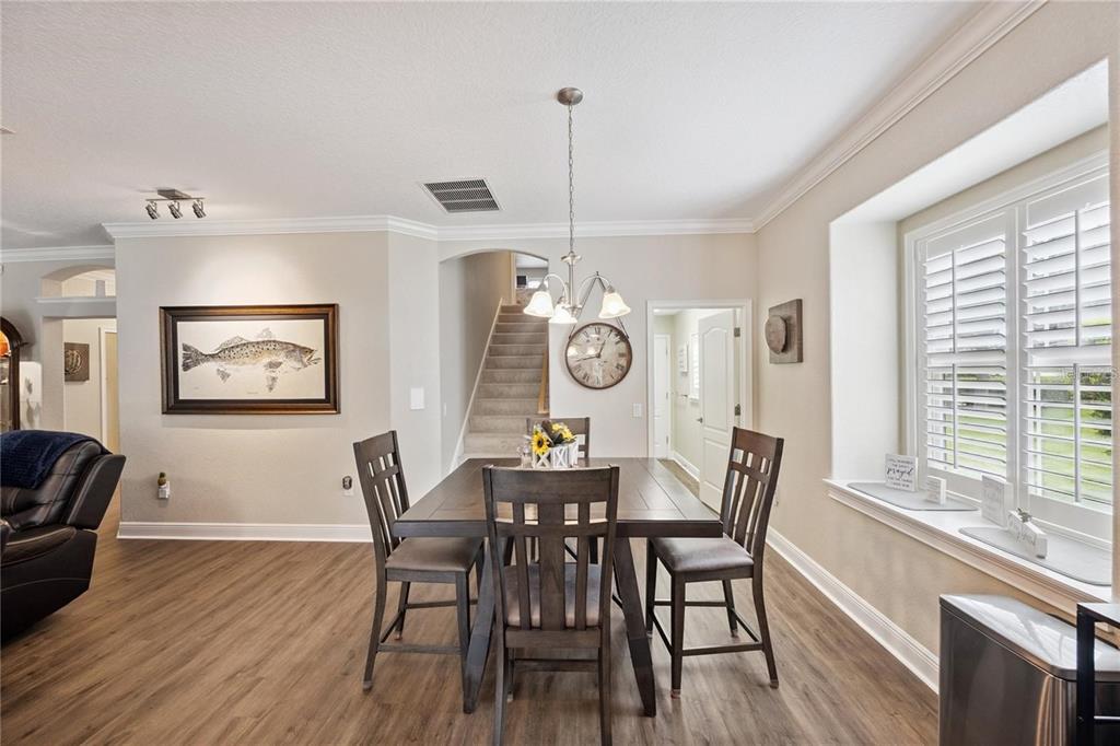 1923 Banning Beach Road Tavares, FL 32778 - Photo 15 of 44 a view of a dining room with furniture window and wooden floor
