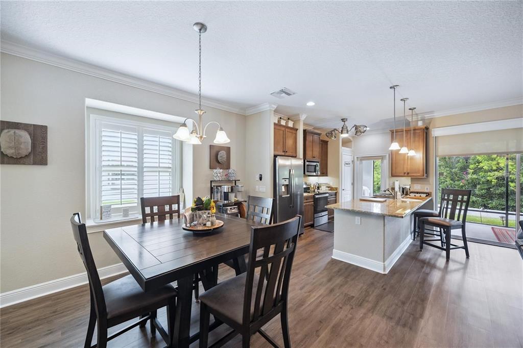 1923 Banning Beach Road Tavares, FL 32778 - Photo 16 of 44 a dining room with furniture window and wooden floor