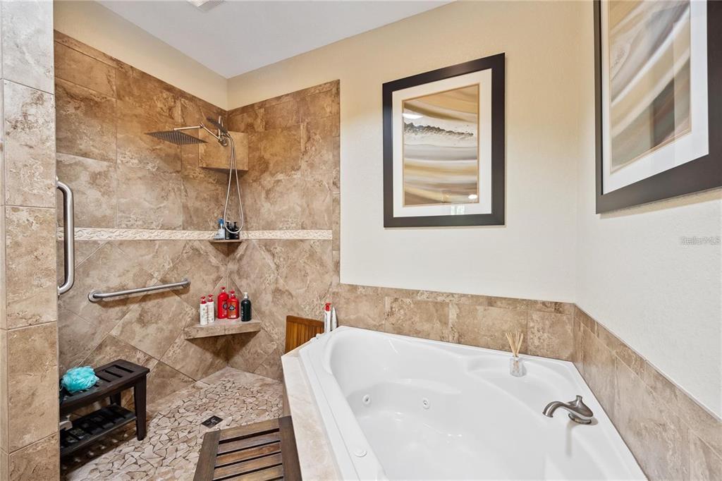 1923 Banning Beach Road Tavares, FL 32778 - Photo 23 of 44 a bathroom with a tub and a shower