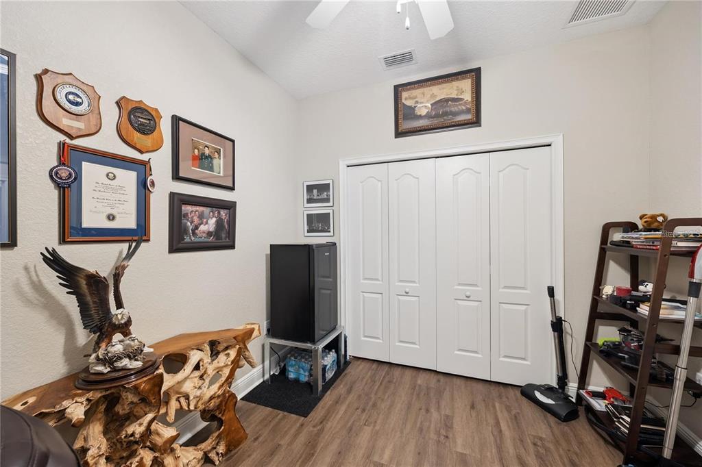 1923 Banning Beach Road Tavares, FL 32778 - Photo 30 of 44 a view of a room with wooden floor and closet