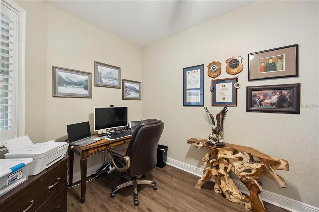 1923 Banning Beach Road Tavares, FL 32778 - Photo 31 of 44 a view of a workspace with furniture and a workspace