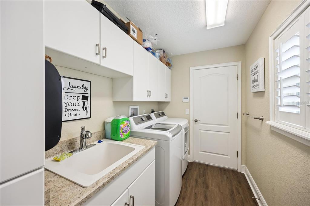 1923 Banning Beach Road Tavares, FL 32778 - Photo 32 of 44 a room that has a sink and a stove in it