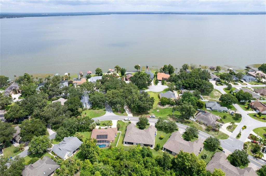 1923 Banning Beach Road Tavares, FL 32778 - Photo 42 of 44 an aerial view of a house with a yard
