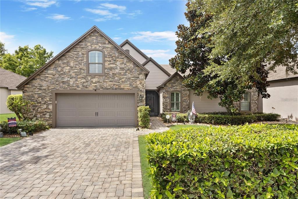 1923 Banning Beach Road Tavares, FL 32778 - Photo 43 of 44 a front view of a house with a garden