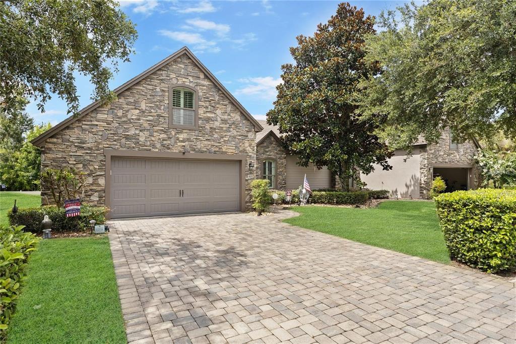 1923 Banning Beach Road Tavares, FL 32778 - Photo 44 of 44 a front view of a house with a yard and garage