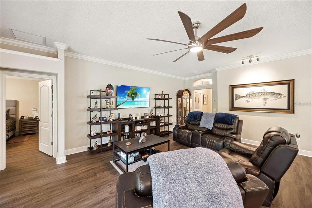 1923 Banning Beach Road Tavares, FL 32778 - Photo 6 of 44 a living room with furniture a rug and wooden floor