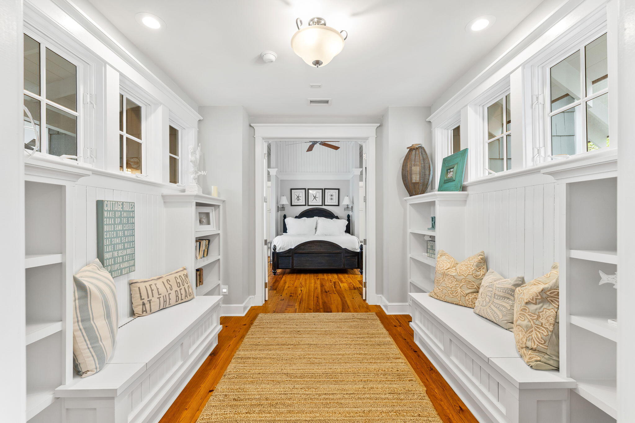 19 Creek Bridge Way Watersound, FL 32461 - Photo 11 of 35 a view of a bedroom with a bed and wooden floor
