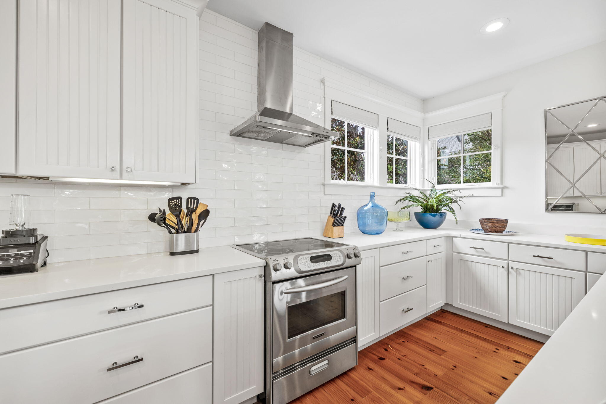 19 Creek Bridge Way Watersound, FL 32461 - Photo 21 of 35 a kitchen with white cabinets stainless steel appliances and sink