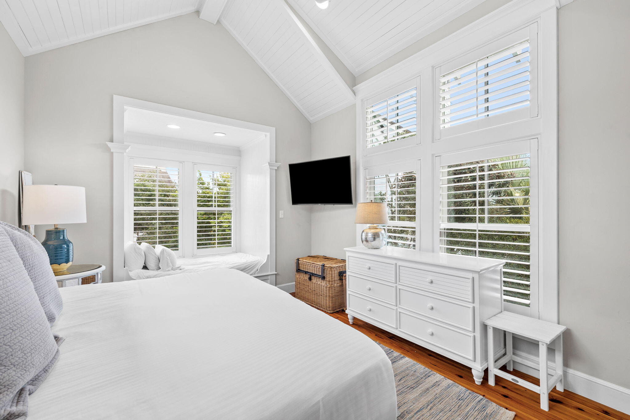 19 Creek Bridge Way Watersound, FL 32461 - Photo 28 of 35 a bedroom with a bed a tv and next to a window