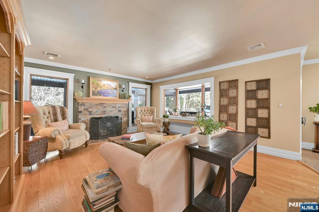 285 Chestnut Ridge Road Woodcliff Lake, NJ 07677 - Photo 17 of 46 a living room with fireplace furniture and a large window