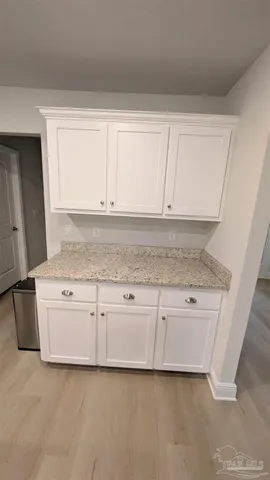 a view of a kitchen with granite countertop cabinets and a sink