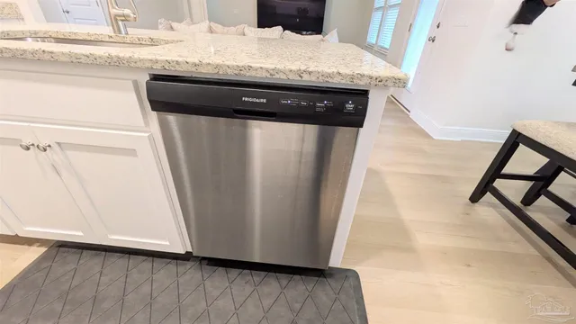 a close view of a sink and washing machine