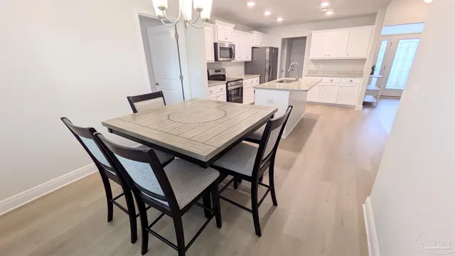 a view of a dining room with furniture