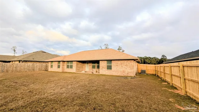 a view of a house with a ocean view