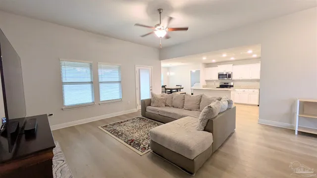 a living room with furniture and a window