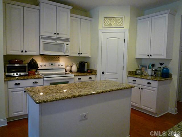 86599 Arrington Road Lancaster, SC 29720 - Photo 4 of 16 a kitchen with stainless steel appliances granite countertop a sink stove and cabinets