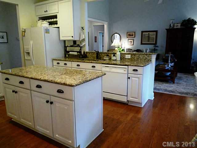 86599 Arrington Road Lancaster, SC 29720 - Photo 5 of 16 a kitchen with cabinets and wooden floor