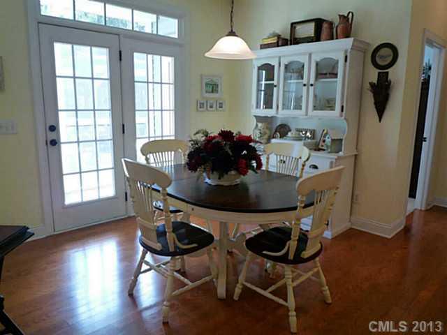 86599 Arrington Road Lancaster, SC 29720 - Photo 6 of 16 a view of a dining room with furniture and wooden floor