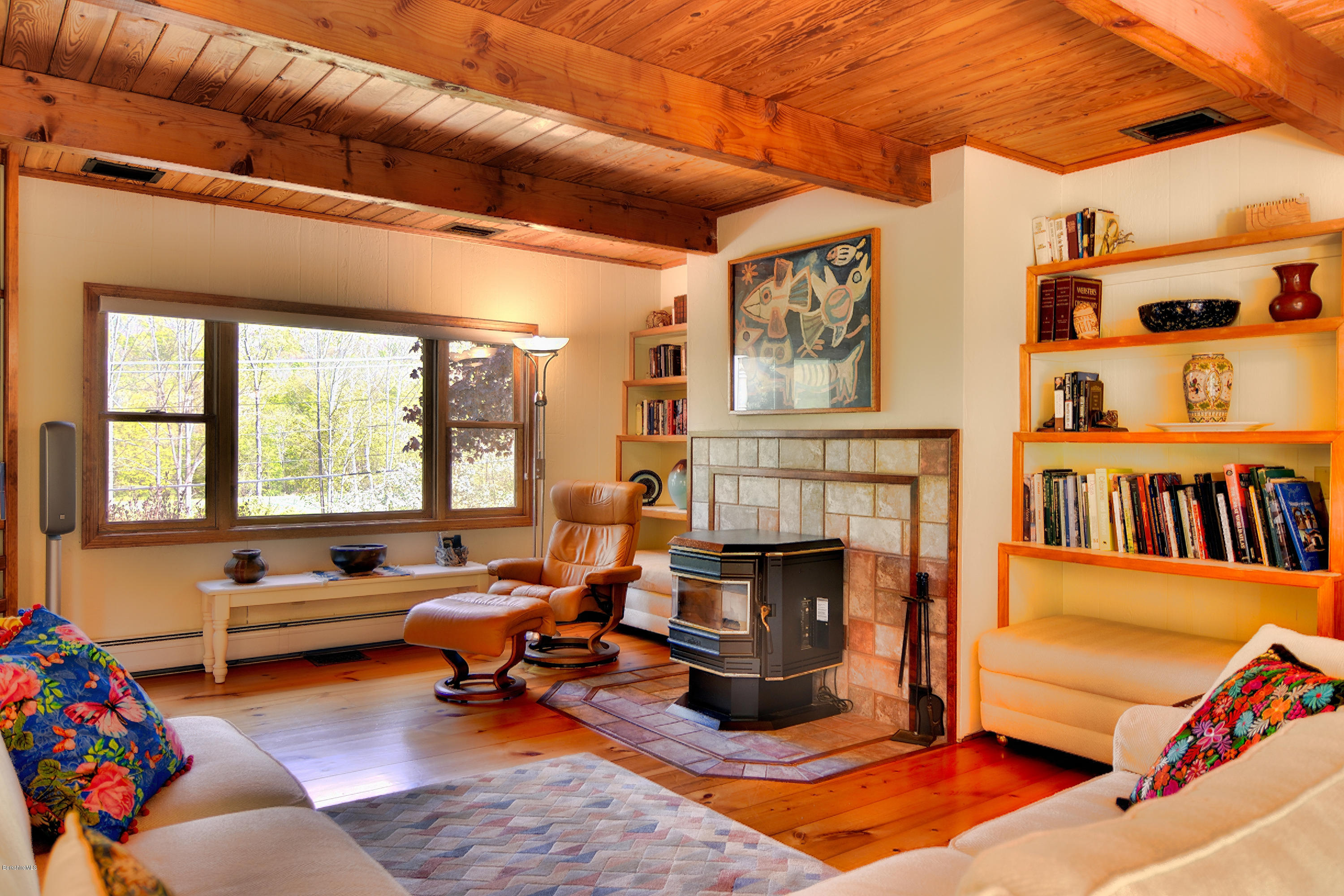 2231 Hancock Road Hancock, MA 01267 - Photo 21 of 39 a living room with furniture hard wood floor and a fireplace