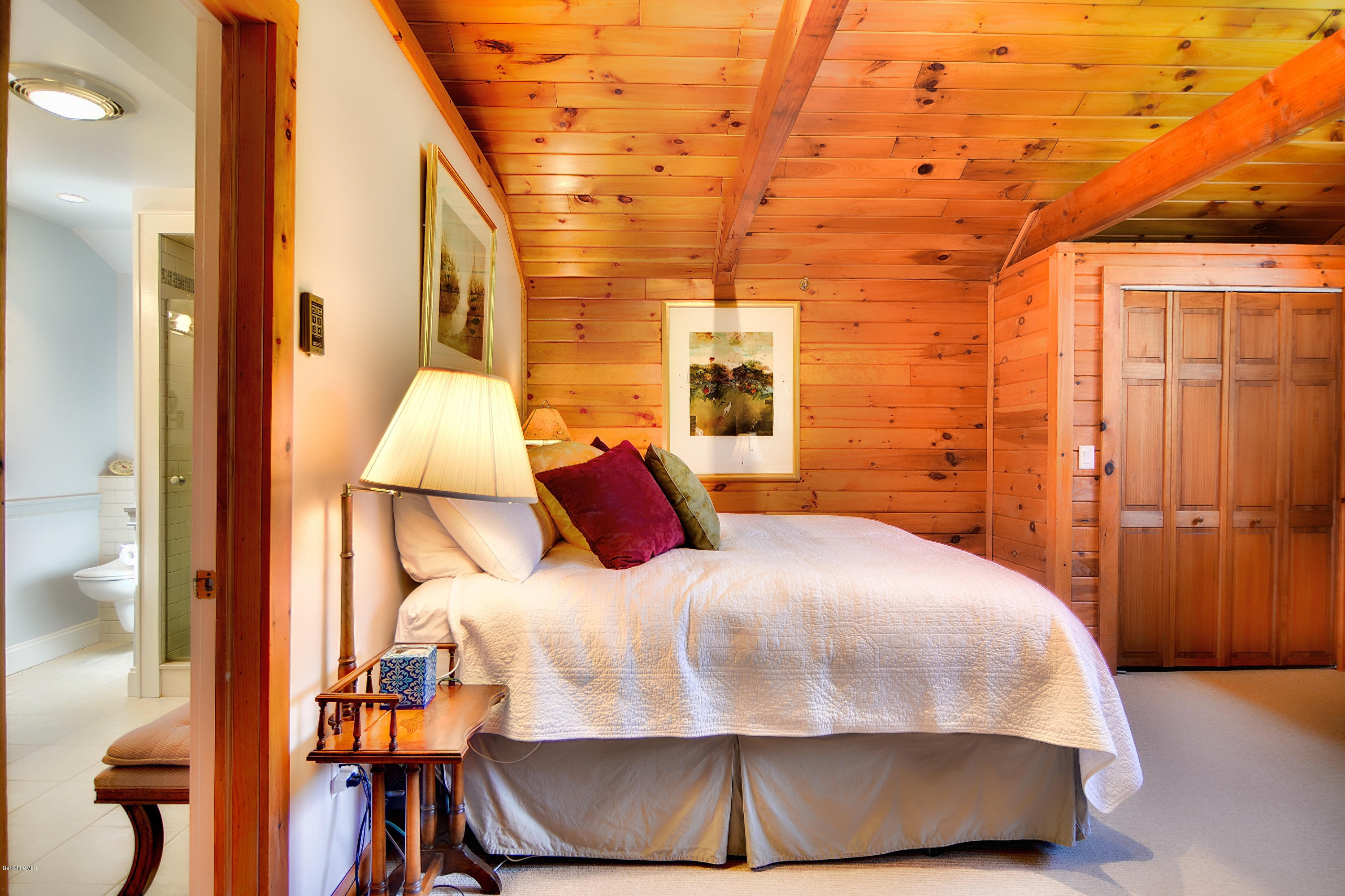 2231 Hancock Road Hancock, MA 01267 - Photo 25 of 39 a bedroom with a bed and wooden floor