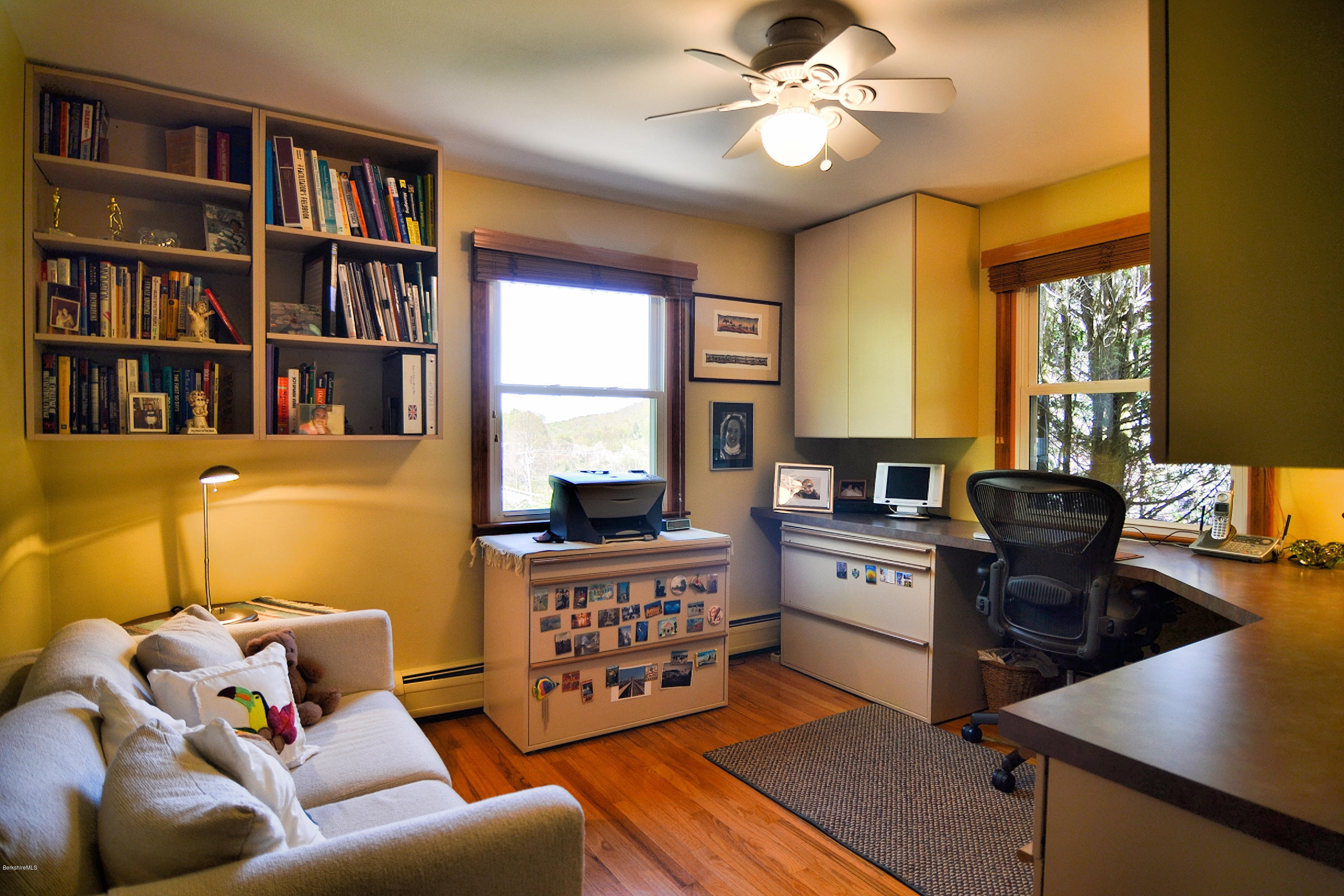 2231 Hancock Road Hancock, MA 01267 - Photo 33 of 39 a living room with furniture and a bookshelf