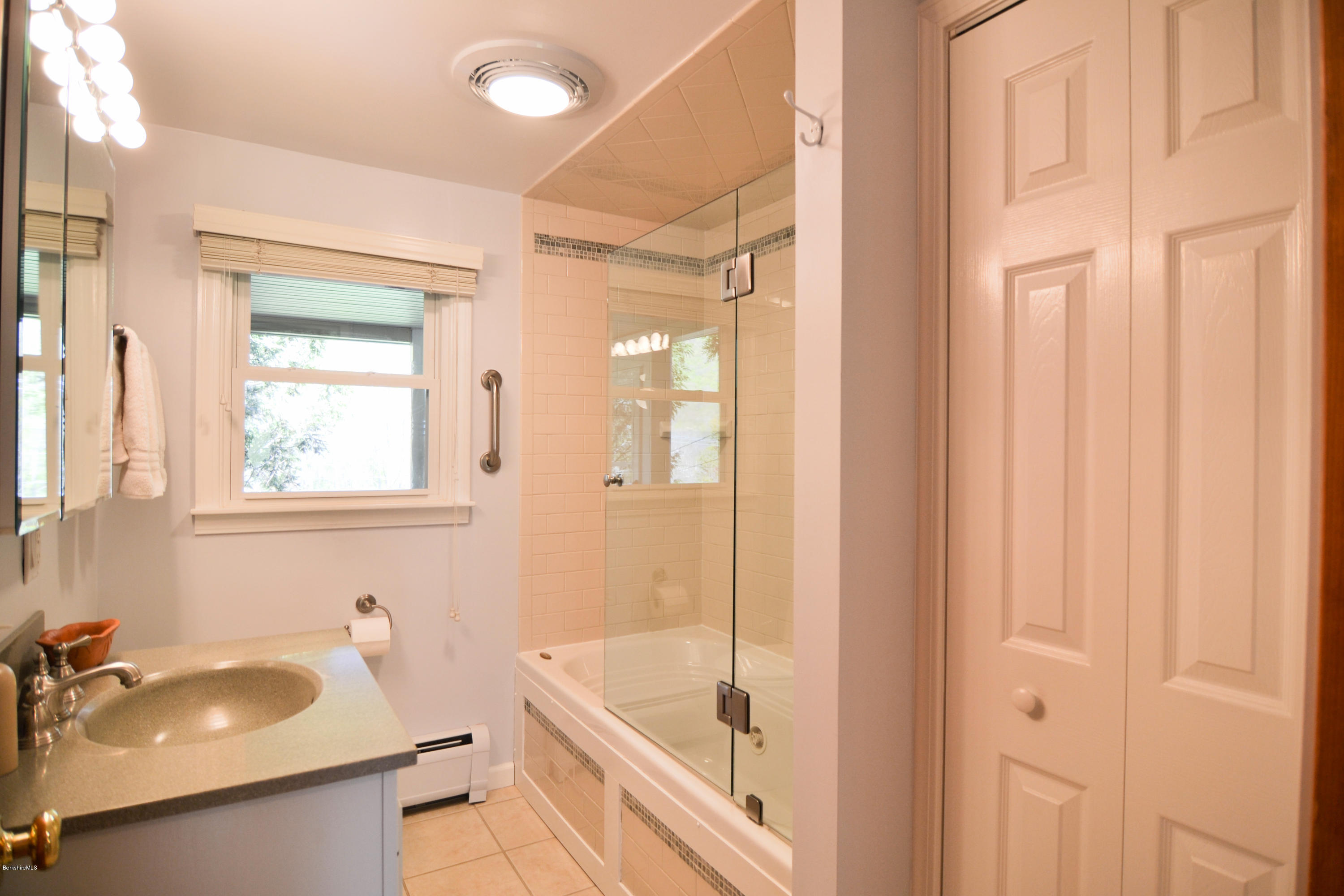 2231 Hancock Road Hancock, MA 01267 - Photo 34 of 39 a bathroom with a tub sink and mirror