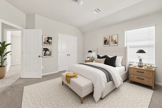 a bedroom with bed and window