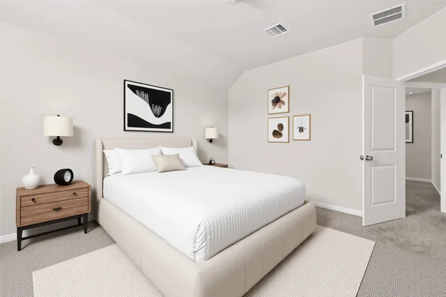 a bedroom with a bed and a view of bathroom