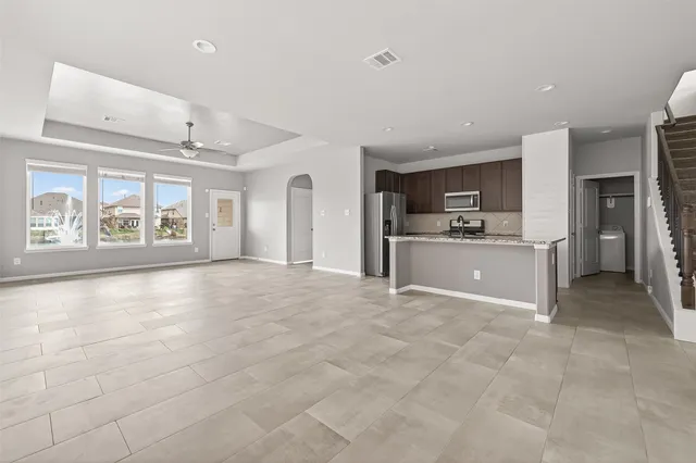 a view of a kitchen with a stove cabinets and a kitchen