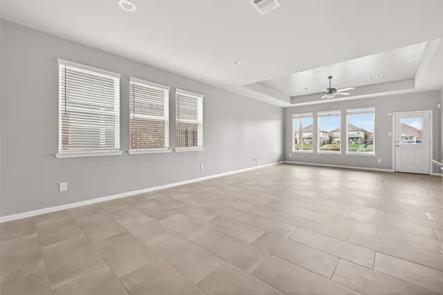 an empty room with windows and view