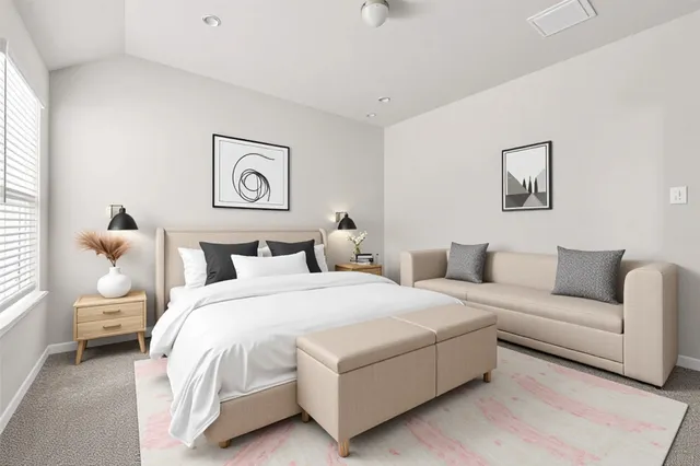 a bedroom with a bed and a couch