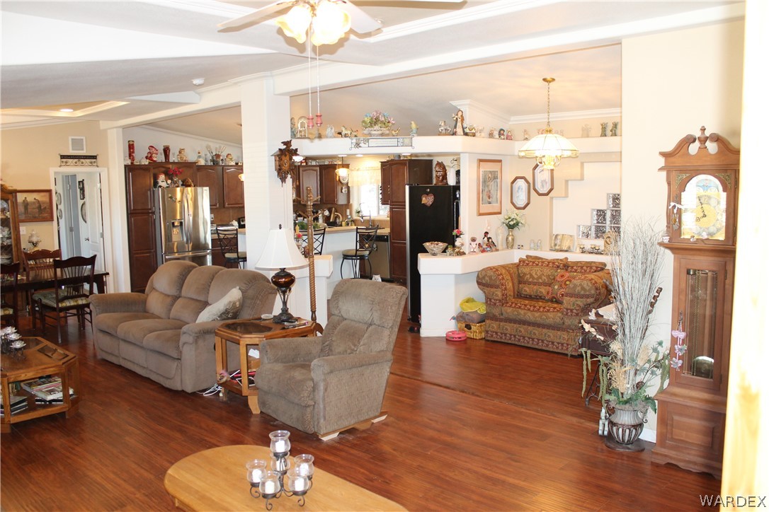 4198 Estrella Road Golden Valley, AZ 86413 - Photo 15 of 50 a living room with furniture and wooden floor