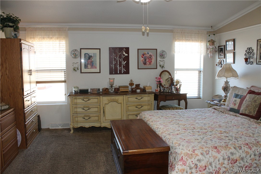 4198 Estrella Road Golden Valley, AZ 86413 - Photo 28 of 50 a bed room with a bed and a window