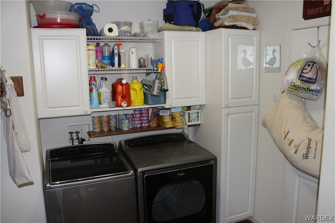 4198 Estrella Road Golden Valley, AZ 86413 - Photo 31 of 50 a close view of a utility room with washer and dryer