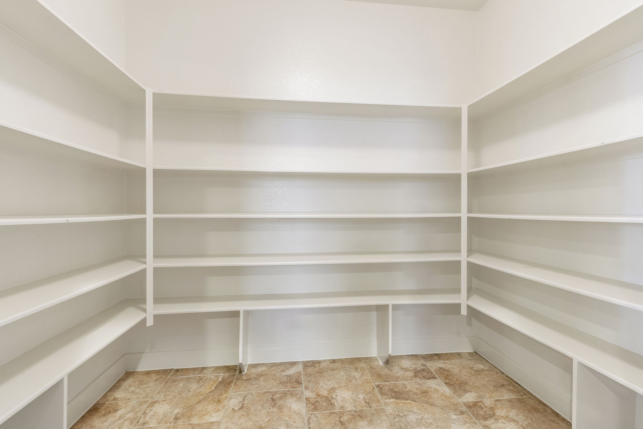 19222 Senterra Lakes Boulevard Spring, TX 77379 - Photo 12 of 45 You will never run out of storage in this massive walk-in pantry, fully equipped with built-in floor to ceiling shelving.