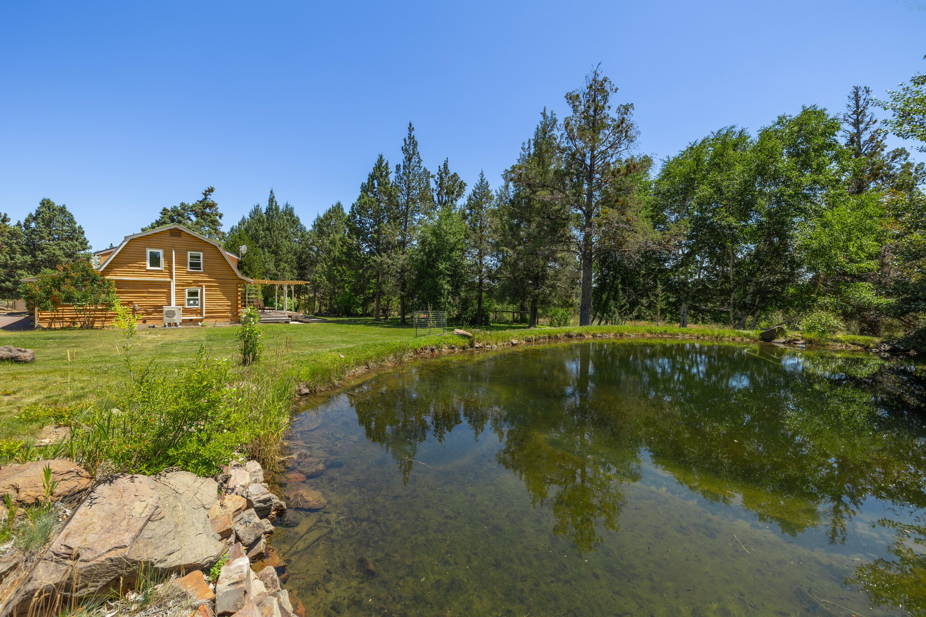 18460 Couch Market Road Bend, OR 97703 - Photo 33 of 51 a view of a lake with outdoor space