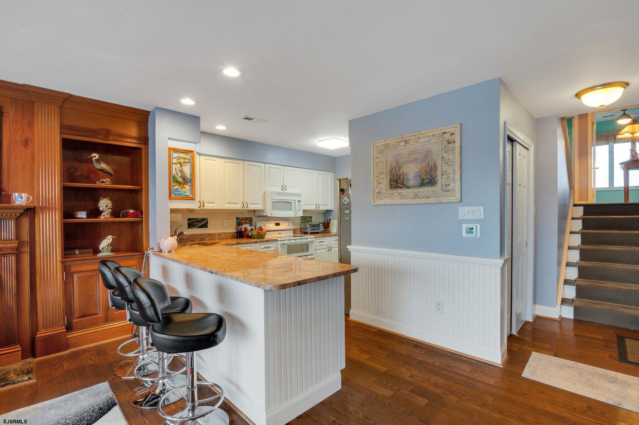 504 Harbour Cove, Unit 504 Somers Point, NJ 08244 - Photo 12 of 30 a kitchen with a table and chairs