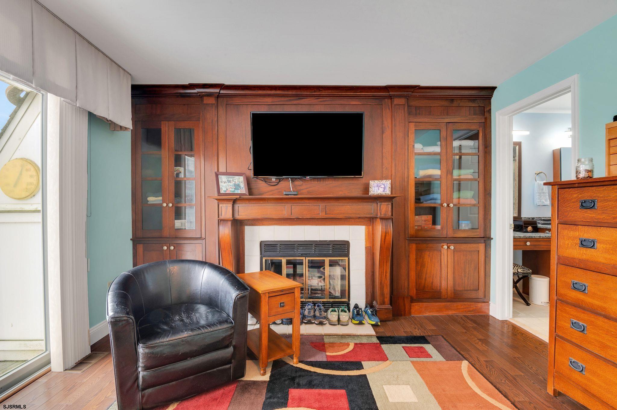 504 Harbour Cove, Unit 504 Somers Point, NJ 08244 - Photo 18 of 30 a living room with furniture and a fireplace
