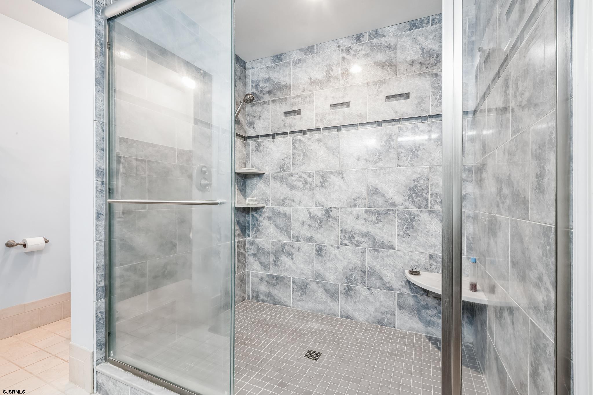 504 Harbour Cove, Unit 504 Somers Point, NJ 08244 - Photo 24 of 30 a bathroom with a glass shower door