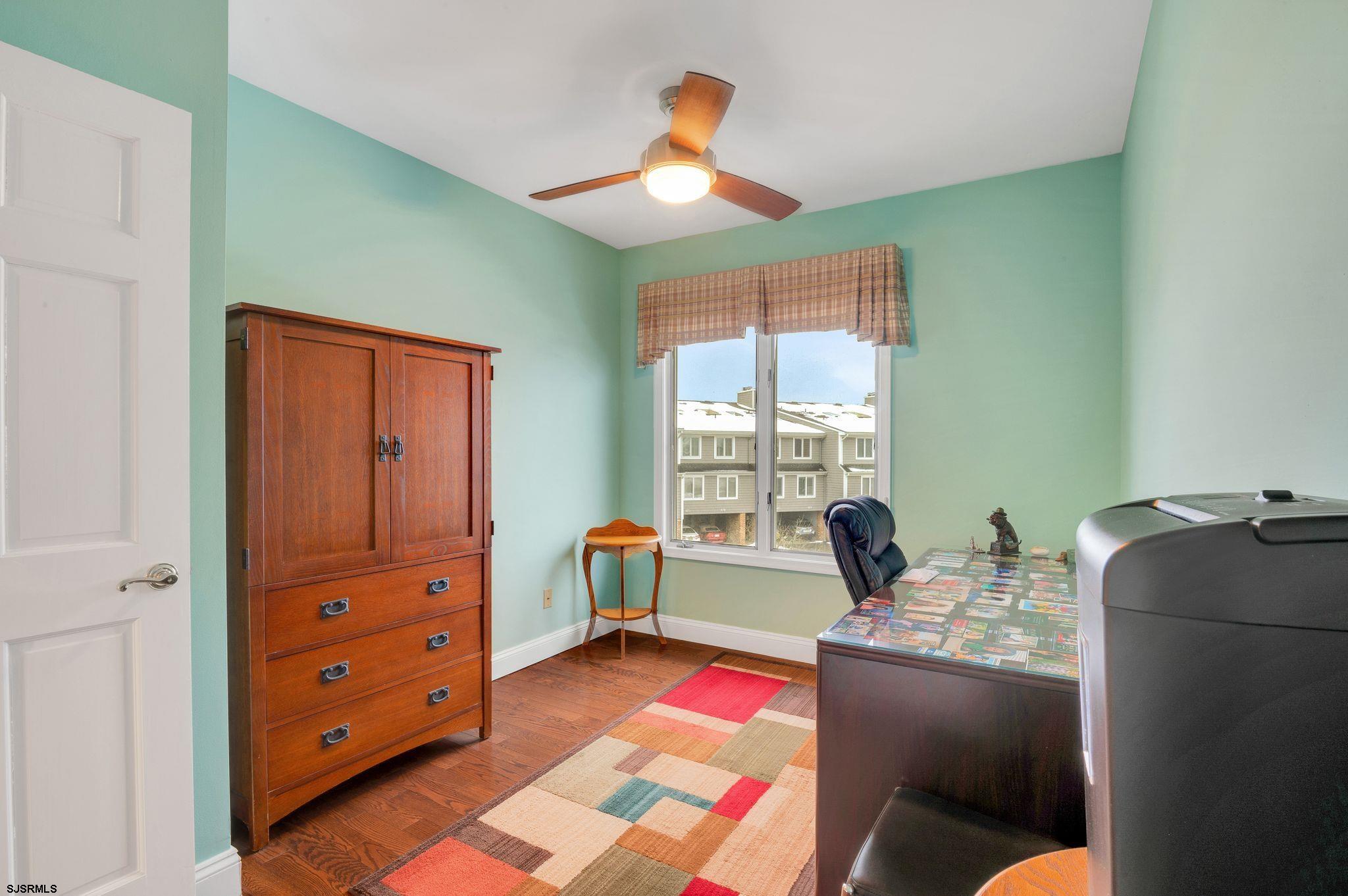 504 Harbour Cove, Unit 504 Somers Point, NJ 08244 - Photo 27 of 30 a living room with furniture and a window