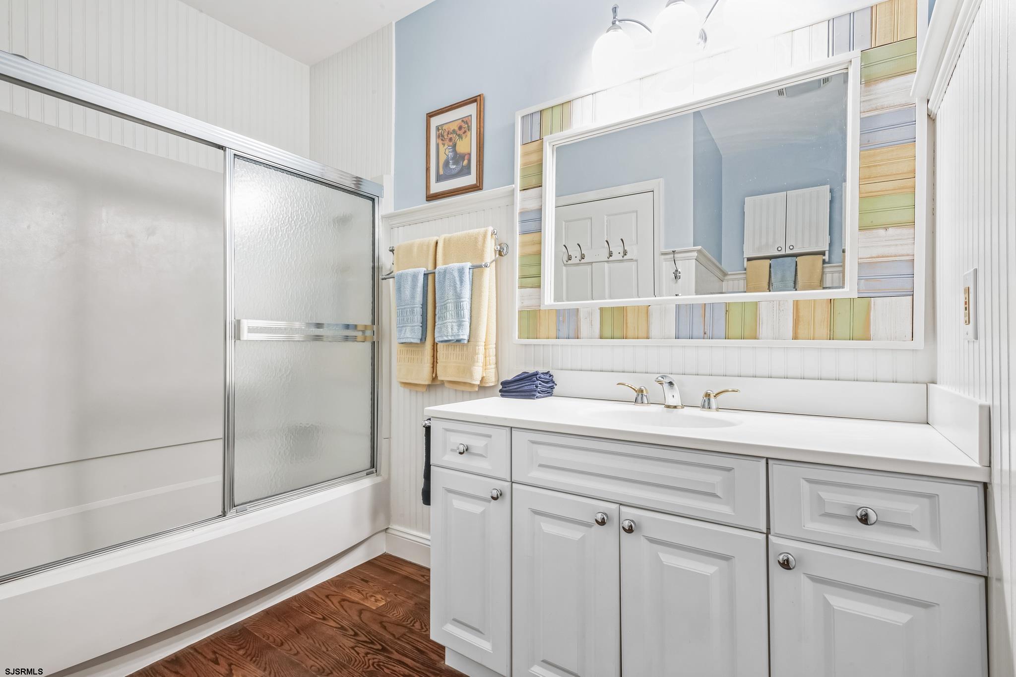 504 Harbour Cove, Unit 504 Somers Point, NJ 08244 - Photo 29 of 30 a bathroom with a double vanity sink mirror and a bathtub