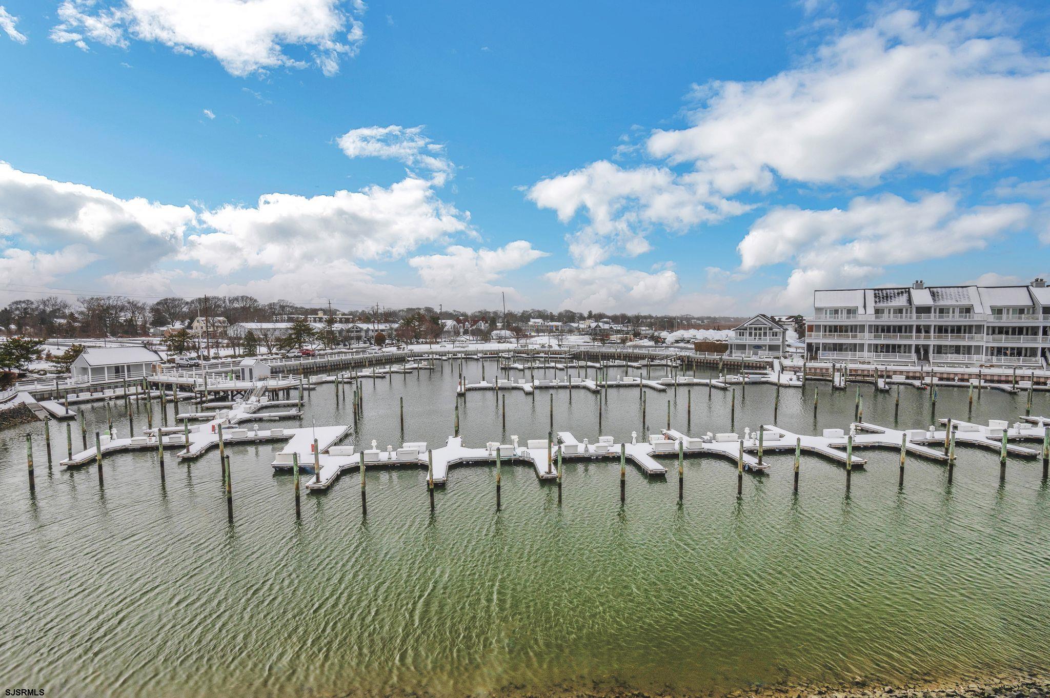 504 Harbour Cove, Unit 504 Somers Point, NJ 08244 - Photo 3 of 30 a view of a lake with a city